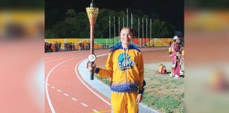Angel Villagracia, an 18-year-old track and field athlete from Capiz, served as the Capiz delegation’s torch bearer during the opening ceremony of the Western Visayas Regional Athletic Association (WVRAA) Meet 2026 in Passi City, Iloilo on March 17. EXPLORE CAPIZ PHOTO