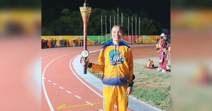 Angel Villagracia, an 18-year-old track and field athlete from Capiz, served as the Capiz delegation’s torch bearer during the opening ceremony of the Western Visayas Regional Athletic Association (WVRAA) Meet 2026 in Passi City, Iloilo on March 17. EXPLORE CAPIZ PHOTO
