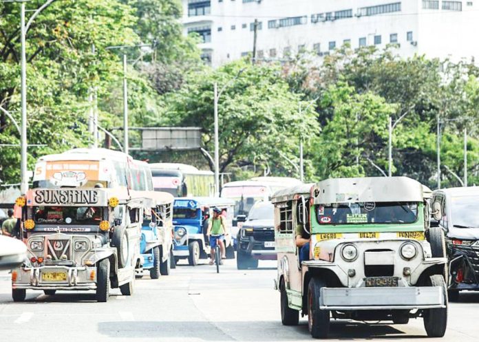 fare hike copy Traditional jeepneys slow down during rush hour traffic along Eliptical Road in Quezon City. Transport groups are pressing for more support amid rising oil prices. PNA