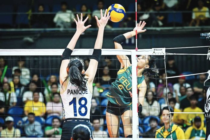 feu Far Eastern University Lady Tamaraws’ Lovely Lopez scores against the defense of Negrense Arah Panique of National University Lady Bullpups. UAAP PHOTO