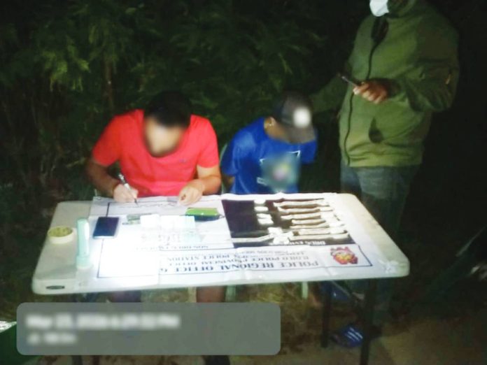 fish vendor A high-value suspect identified by the alias “Pantoy” (center) yields P884,000 worth of alleged shabu in an anti-illegal drug operation in Lemery, Iloilo on March 23, 2026. PRO-6 PHOTO