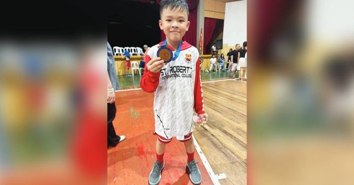 guison “I hope I can make more 3-point shots in my future games,” says Tyler Guion after Iloilo City’s basketball match against Roxas City in the ongoing elementary boys basketball event of the Western Visayas Regional Athletic Association Meet. FILE PHOTO
