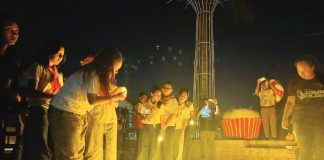 LIGHTS OUT, HOPE ON. Participants light candles at the Iloilo Provincial Capitol grounds during Earth Hour 2026: “Ligum Dulom Year 4”, symbolizing collective action and renewed commitment to energy conservation and environmental protection. PHOTOS FROM PGENRO-PROVINCE OF ILOILO
