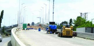 Repair works continue at the Buhang Flyover in Barangay Buhang, Jaro, Iloilo City. Damaged slabs are being replaced. The P315-million flyover, which developed cracks on several sections, is targeted to reopen to motorists in May 2026 once rehabilitation works are completed. AJ PALCULLO/PN