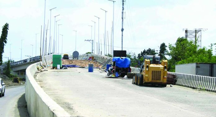 Repair works continue at the Buhang Flyover in Barangay Buhang, Jaro, Iloilo City. Damaged slabs are being replaced. The P315-million flyover, which developed cracks on several sections, is targeted to reopen to motorists in May 2026 once rehabilitation works are completed. AJ PALCULLO/PN