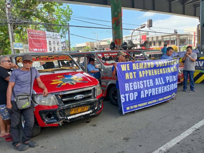 jeepneys Demonstrators staged a protest on Thursday morning at Infante Flyover in Molo, Iloilo City, decrying the continued rise in fuel prices and its impact on the livelihoods of many residents. Photo courtesy of AJ Palcullo/PN