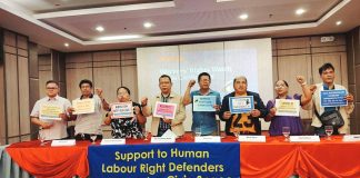 Labor leaders and advocates raise placards and fists during a Workers’ Rights Watch press conference in Iloilo City, calling for wage increases, protection of union rights, and stronger safeguards for labor amid rising economic pressures. NELJOY GALIGAO/PN