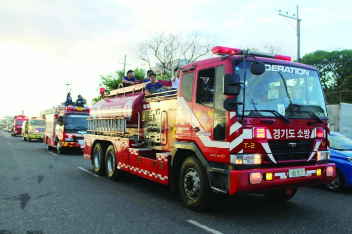 neljoy_fire_month_copy_resized_compressed Bureau of Fire Protection personnel lead a motorcade through major streets of Iloilo City, sounding sirens as part of the official kick-off of Fire Prevention Month on March 1, calling on residents to remain vigilant amid rising fire incidents. NELJOY GALIGAO/PN