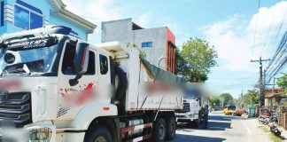 Dump trucks suspected of transporting illegally quarried materials are intercepted and impounded by police during coordinated enforcement operations in Iloilo province on Feb. 28, 2026. Authorities seized nine trucks. ILOILO POLICE PROVINCIAL OFFICE PHOTO