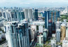 High-rise buildings in the Ortigas Business District in Pasig City looms large in the horizon as seen through a drone shot in November 2025. Moody’s Analytics cut its growth forecast for the Philippines in 2026 to 4.9 percent, from 5.1 percent previously. INQUIRER PHOTO / GRIG C. MONTEGRANDE