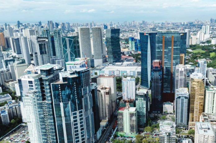 ph growth High-rise buildings in the Ortigas Business District in Pasig City looms large in the horizon as seen through a drone shot in November 2025. Moody’s Analytics cut its growth forecast for the Philippines in 2026 to 4.9 percent, from 5.1 percent previously. INQUIRER PHOTO / GRIG C. MONTEGRANDE