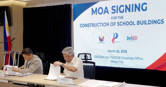 photo 1 (32) PAGCOR Chairman and CEO Alejandro H. Tengco (right) and Education Secretary Sonny Angara sign the Memorandum of Agreement between PAGCOR, the Department of Education, and the initial group of 25 local government units that will each receive Php55 million for the construction of a three-story school building in their respective areas.