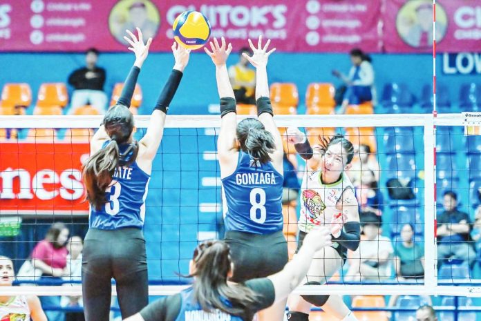 sports Chameleons copy Negrense Jonah Sabete-Escamillan of Nxled Chameleons scores against the defense of Jovelyn Gonzaga and Thea Gagate of ZUS Coffee Thunderbelles. PVL PHOTO