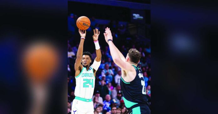 sports Charlotte copy_superimposed Charlotte Hornets forward Brandon Miller shoots the ball against the Portland Trail Blazers during the first quarter of their encounter at Spectrum Center. REUTERS