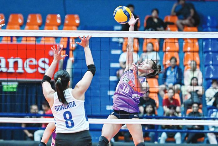 sports PVL Choco Mucho Flying Titans’ Cherry Rondina soars for an attack against ZUS Coffee Thunderbelles’ Jovelyn Gonzaga. PVL PHOTO