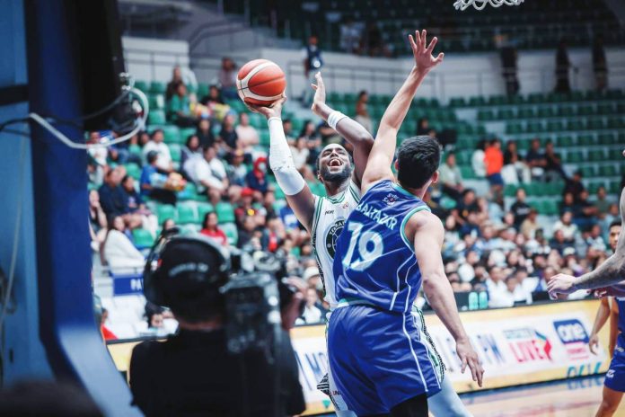 sports Terra Terrafirma Dyip import Ali Mubashar attempts to score against the defense of Converge FiberXers' Justine Baltazar. PBA PHOTO