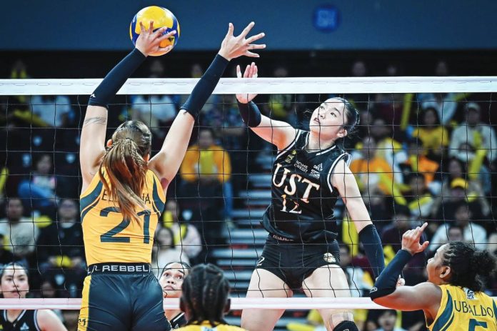 sports Tig UST Golden Tigresses rookie Lianne Penuliar tries to score against FEU Lady Tamaraws’ Jazlyn Ellarina during their UAAP Season 88 women’s volleyball clash at the SM Mall of Asia Arena in Pasay City. UAAP PHOTO
