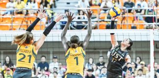 Angeline Poyos of UST attacks against the defense of Faida Bakanke of FEU. UAAP PHOTO
