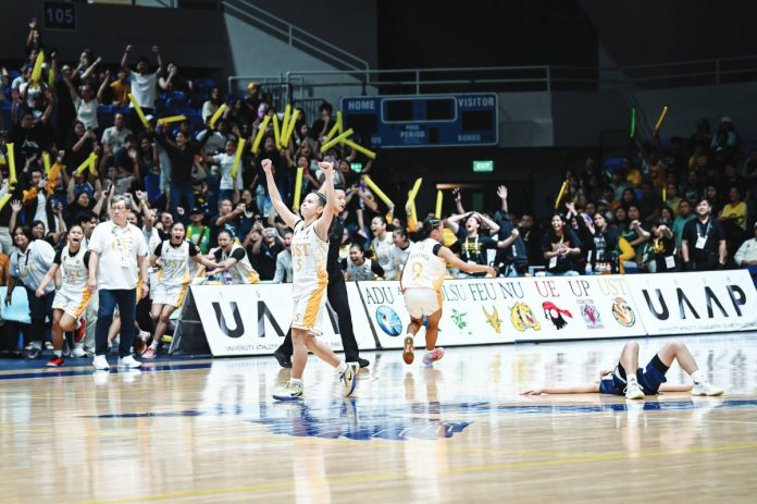 sports UST copy Kathrina Insoy celebrates after University of Santo Tomas Junior Golden Tigresses completed their title defense in the UAAP Season 88 Girls’ Basketball tournament. UAAP PHOTO