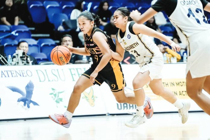 sports UST copy Despite the absence of suspended head coach Sen Dysangco, the Junior Growling Tigresses rose to the challenge behind Ilongga Lea Pinuela. UAAP PHOTO