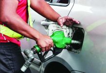 A gasoline attendant fills up a vehicle at a petroleum station in Quezon City on March 2, 2026. Motorists are paying more for petroleum products this week following a major price hike on March 3 amid the strikes between the United States and Iran. INQUIRER PHOTO / GRIG C. MONTEGRANDE