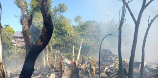 Firefighters work to douse the remains of a fire that tore through Zone 2, Barangay Gustilo, La Paz, Iloilo City on Thursday afternoon, March 19. According to authorities, the blaze gutted approximately 15 houses, most of which were made of light materials. AJ PALCULLO/PN