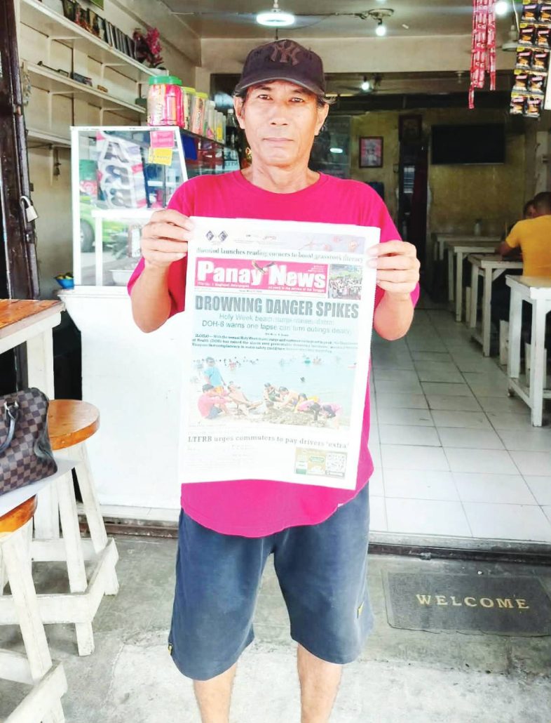 Albert Alovera of Santos News Stand, owned by Jacky Santos since 1987, on Fuentes Drive, Roxas City holds a PN newspaper.