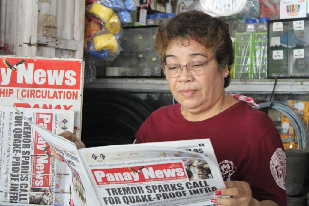 Elena Celino, 63, originally from Lonoy in Roxas City, has a newsstand at Pavia Market and has been selling newspapers for over 15 years.