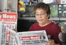 Elena Celino, 63, originally from Lonoy in Roxas City, has a newsstand at Pavia Market and has been selling newspapers for over 15 years.