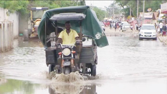 Angola copy A motorized delivery trike makes its way through flooded waters in Angola. EVN