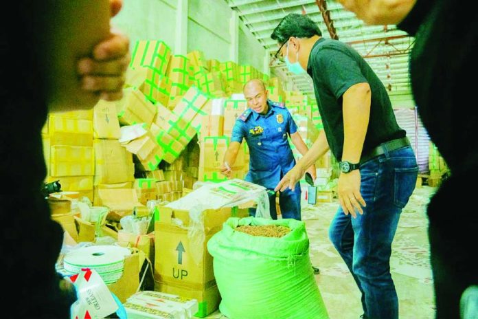 Bacolod_cigar_compressed_resized Bacolod City Mayor Greg Gasataya, together with personnel from the Bacolod City Police Office, led the inspection of a warehouse in Barangay Alijis allegedly used to store raw materials for illegal cigarette production. The facility reportedly contained millions of pesos worth of packaging materials and related paraphernalia. BCCO-PIO PHOTO