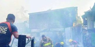 Firefighters conduct a mopping-up operation following a massive fire that tore through a residential area in Barangay 14, Bacolod City on Tuesday afternoon, April 21, 2026. Authorities reported that the blaze destroyed 22 houses and left 10 others partially damaged. BARANGAY 14 PHOTO