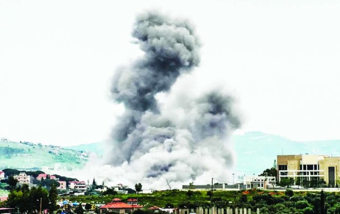 Smoke is seen rising in the town of Arnoun, in southern Lebanon, following an Israeli air attack on Sunday. GETTY IMAGES