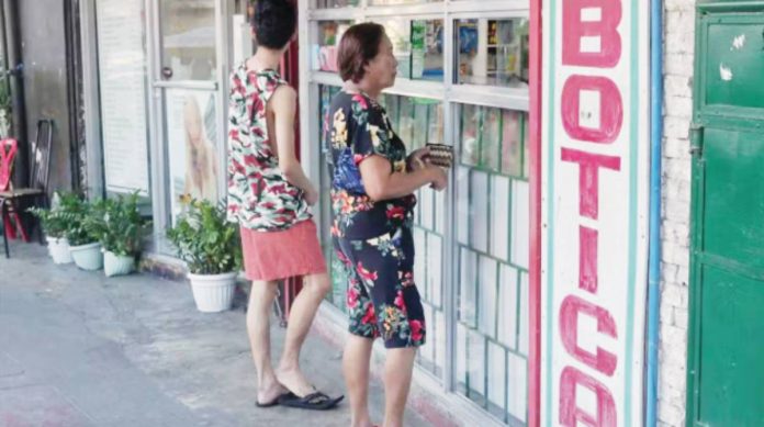 A customer buys from a pharmacy in Barangay Kamuning, Quezon City. The Bureau of Internal Revenue has exempted value-added tax several medicines for cancer, diabetes, hypertension, kidney disease, mental illness and tuberculosis. INQUIRER PHOTO / GRIG C. MONTEGRANDE