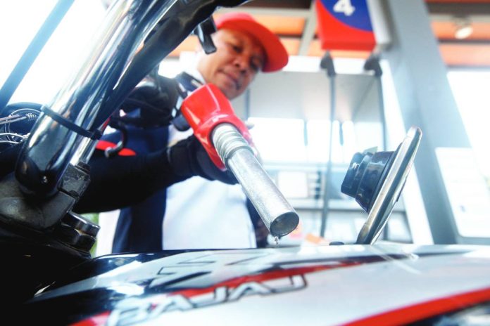 ESSENTIAL An attendant refills the fuel tank of a motorcycle at a gas station in Paco, Manila. President Ferdinand Marcos Jr. has announced that fuel prices will drop, with diesel set to record the largest reduction. PNA