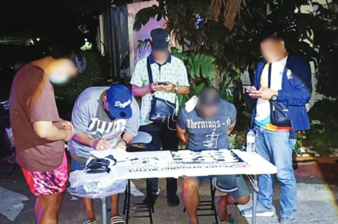 A 52-year-old resident (second from right) of La Paz, Iloilo City was caught with around P1,020,000 worth of suspected shabu valued at in an anti-illegal drug operation in Barangay Bonifacio, Arevalo district, on April 5, 2026. RPDEU 6 PHOTO