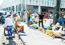 Photo shows bolanteros at the Iloilo Terminal Market.