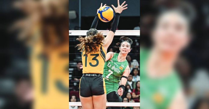Shevana Laput of De La Salle University Lady Spikers scores against the defense of Far Eastern University Lady Tamaraws' Alyssa Devosora. UAAP PHOTO