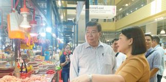 Former Senate President Franklin Drilon engages with local vendors at the Iloilo Terminal Market in Iloilo City on Tuesday, April 14, 2026. He was joined by Mayor Raisa Treñas and other city government officials. JAYMEL EIMAN/UNIVERSITY OF ANTIQUE INTERN PHOTO