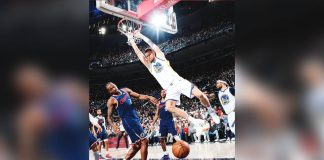 Golden State Warriors center Kristaps Porzingis soars for a two-handed dunk. PHOTO COURTESY OF GOLDEN STATE WARRIORS