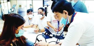 A nurse checks the blood pressure of a patient during a medical mission in Quezon City. The Philippine Institute for Development Studies says local government units spend only about P850 per capita on average on health and nutrition programs, falling well short of the estimated P1,827.8 per person annually needed to deliver essential primary healthcare services. PNA