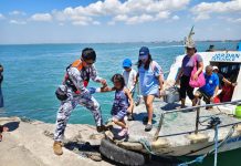 Easter exodus: 220k passengers swamp WV ports, no incidents reported A Philippine Coast Guard personnel assists a young passenger as pilgrims and travelers disembark at a port in Guimaras during the Holy Week rush, part of intensified safety operations across Western Visayas. PHOTO FROM PCG- GUIMARAS STATION