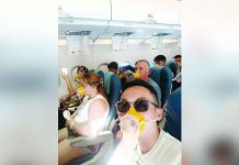 Passengers onboard Philippine Airlines Express flight PR 2544 wear oxygen masks as they endure a mid-air emergency caused by a cabin pressurization problem, moments before the aircraft made an emergency landing in Iloilo on April 19, 2026. Photo courtesy of passenger Jong Narciso