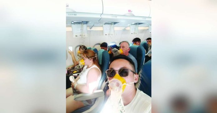ime flight1 copy_compressed_superimposed Passengers onboard Philippine Airlines Express flight PR 2544 wear oxygen masks as they endure a mid-air emergency caused by a cabin pressurization problem, moments before the aircraft made an emergency landing in Iloilo on April 19, 2026. Photo courtesy of passenger Jong Narciso
