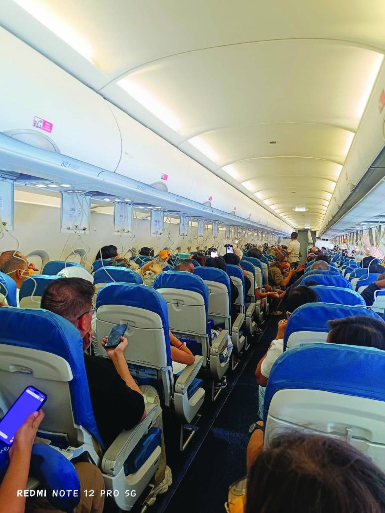 Tension fills the cabin as oxygen masks deploy across rows of passengers during the in-flight emergency of PR 2544, which was diverted to the Iloilo International Airport due to insufficient oxygen supply at cruising altitude. Photo courtesy of passenger Jong Narciso