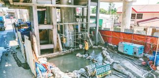 AGANAN FLYOVER REHAB IN FULL SWING. Workers navigate pooled water beneath the structure as foundation strengthening and grouting works continue on the long-delayed Aganan Flyover in Pavia, Iloilo, part of efforts to fast-track completion after three years of stoppage. DPWH-6 PHOTO