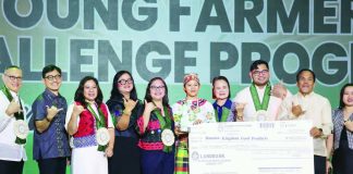 AWARD-WINNING AGRIPRENEUR. Joy C. Saban of Lambunao, Iloilo, representing Banana Kingdom Food Products, receives her award and P300,000 cash prize after placing 3rd in the Start-Up Component (Food Processing Category) of the Young Farmers Challenge Program Season 5 National Pitching Competition in Iloilo City. DA-6