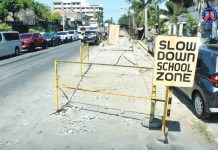 A “Slow Down School Zone” sign stands beside an unfinished drainage and road excavation site in Molo, Iloilo City. This has affected motorists, nearby residents, and students for nearly two years now. DPWH PHOTO