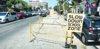 A “Slow Down School Zone” sign stands beside an unfinished drainage and road excavation site in Molo, Iloilo City. This has affected motorists, nearby residents, and students for nearly two years now. DPWH PHOTO