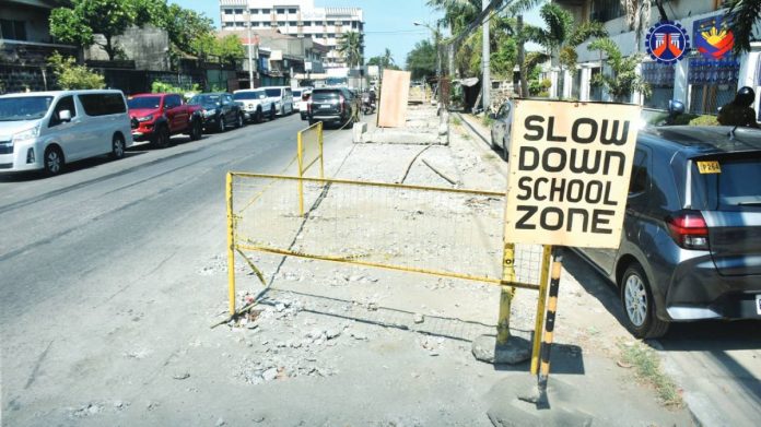 mai delay city road copy A “Slow Down School Zone” sign stands beside an unfinished drainage and road excavation site in Molo, Iloilo City. This has affected motorists, nearby residents, and students for nearly two years now. DPWH PHOTO